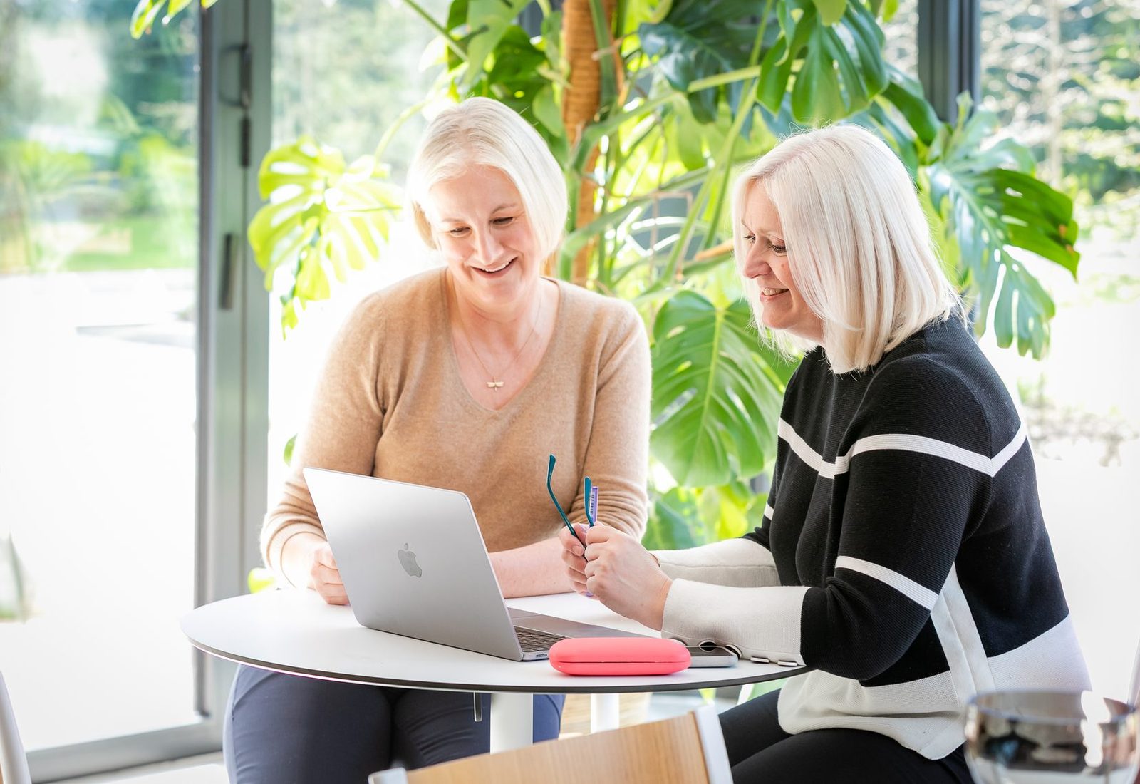 Sally Rasmussen working through a plan with a client